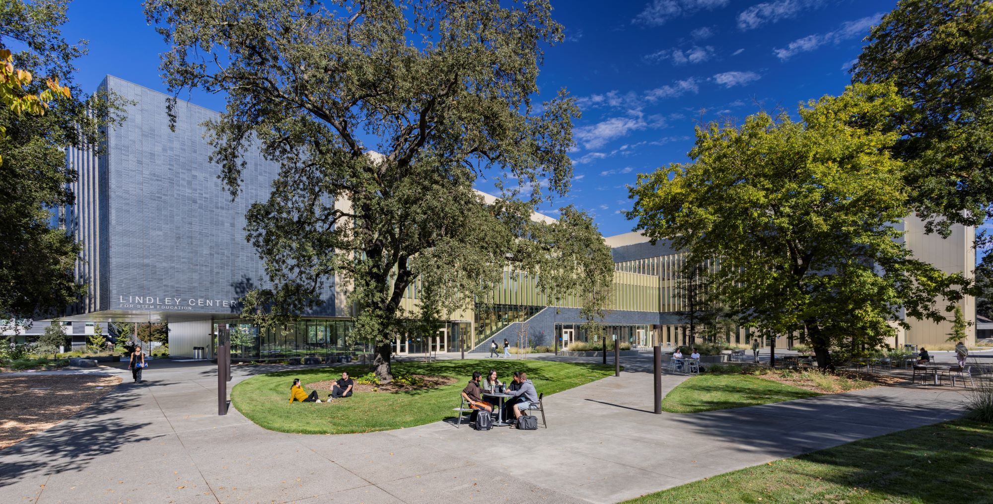 Students sitting in the large quad of the Lindley Center on a sunny day